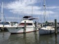 A Cabin Cruiser and a Classic Sailboat