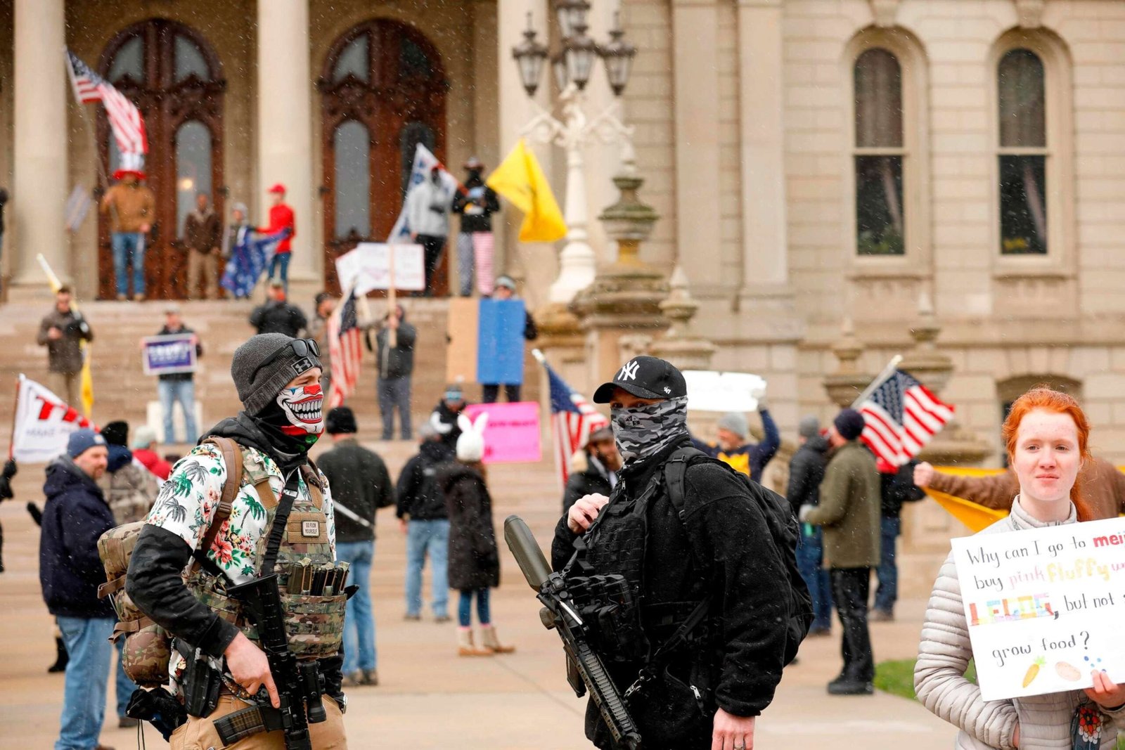 A protest organized by "Michiganders Against Excessive Quarantine" gathers around the Michigan State Capitol in Lansing, Mich., April 15, 2020. Jeff Kowalsky/AFP via Getty Images