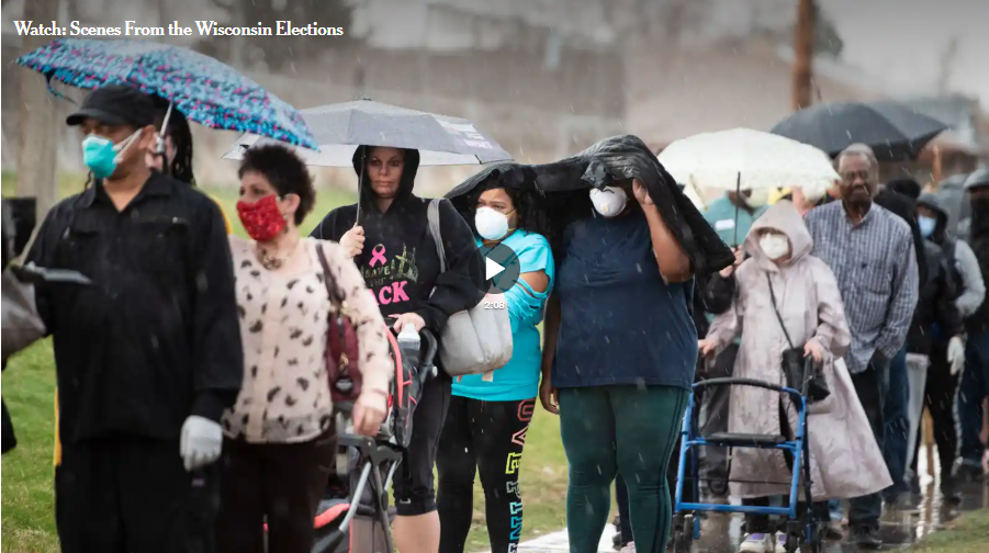 People standing in a long line in the rain, during COVID-19 lockdown, to vote in Wisconsin 2020 Primary Elections