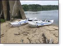 Two kayaks on a beach