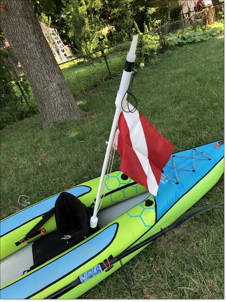Light Mast In Kayak rod holder, with flag and light