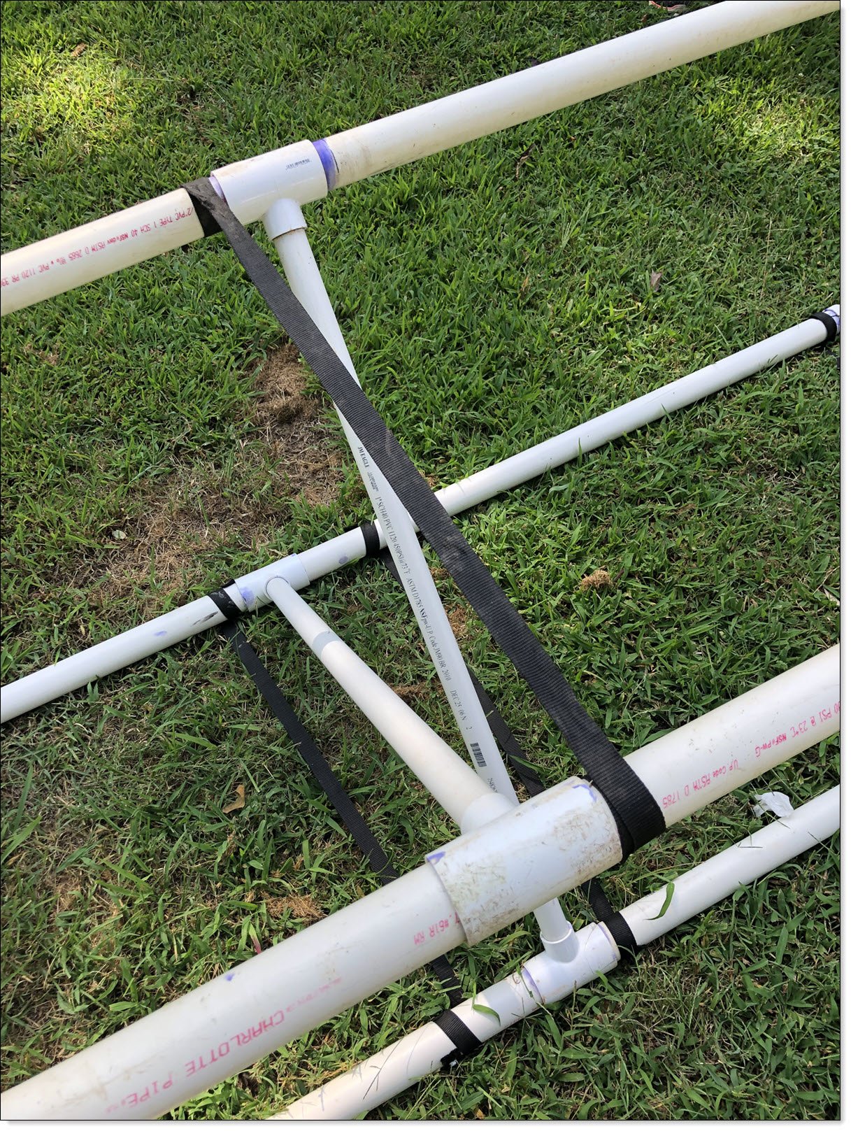 Bottom of kayak work stand showing single supporting nylon strap