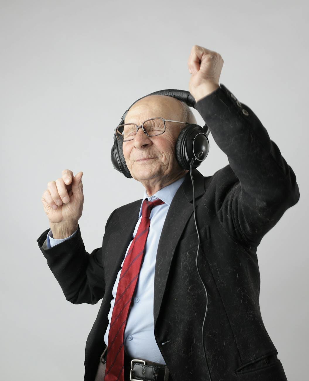 man in black jacket wearing black headphones. Photo by Andrea Piacquadio on Pexels.com. Celebrating Retirement