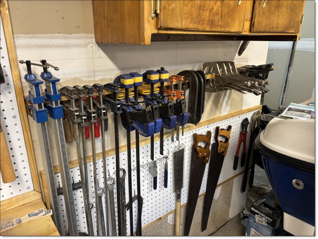 Bar-clamp wall-mounted storage rail