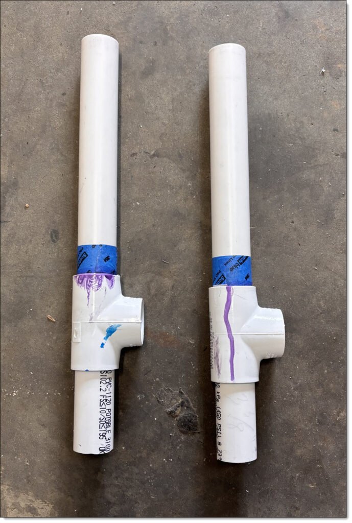 Showing two PVC pipe and pipe fitting assemblies, with blue painters tape as a guide for aligning the pipe into the fittings. 