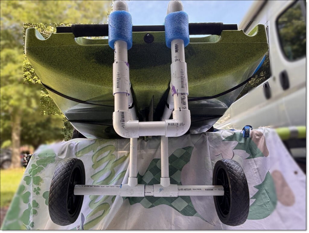 Underside of a Native Watercraft Slayer Max Ten Propel Kayak, showing the twin channels used to align the kayak cart. 