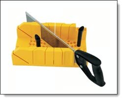 A Stanley plastic mitre box with hand backsaw