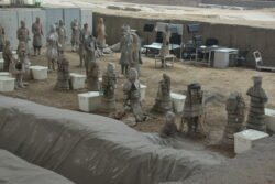 Restoration in Process terracotta warrior figures in various stages of repair and restoration