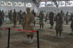 Restoration in Process terracotta warrior figures in various stages of repair and restoration