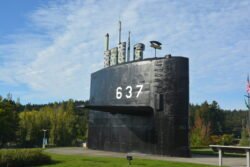 The Sail (fairwater) of the former USS Sturgeon, SSN 637, now on display at the Undersea Museum in Keyport, Washington. This was lead boat of the highly successful 637 class fast attack submarines. In their era, these were some of the most sophisticated and reliable nuclear submarines in the world. Unusual for submarine fairwater exhibits, this fairwater has several masts and antennas, and the number one periscope, in a partially raised position.