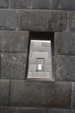 Looking through the "windows" created in the interior walls of the former Inca Temple of the Sun, Cusco, Peru