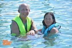 Ron and Winnie holding a Shark at Compass Cay in the Bahamas.
