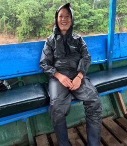 Winnie on a passenger boat on the Tambopata River, in the southeastern Peruvian rainforests. We had been exploring a demonstration tropical farm across the river from our eco-tourist lodge Posada Amazonas. It had been raining for the past hour.