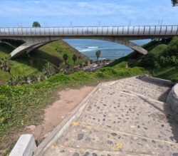 The Ave Reducto Bridge crossing over Subida Armendariz, Miraflores District of Lima, Peru. Subida Armendariz is a main highway leading down to the Pacific Ocean beaches, with a pedestrian walkway on the one side.