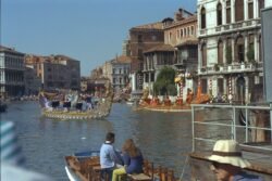 Decorative boats powered by oars on a canal of Venice,