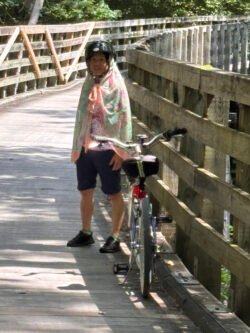 Weifang Charest along the Virginia Creeper Rail Trail with her bicycle