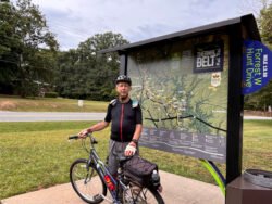 Winnie and Ron riding their bicycles on the Thermal Belt Rail Trail, a 27-mile round-trip bicycle walking trail.