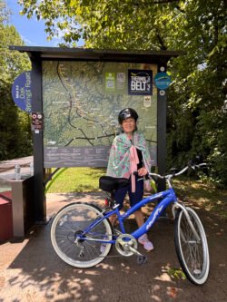Winnie and Ron riding their bicycles on the Thermal Belt Rail Trail, a 27-mile round-trip bicycle walking trail.