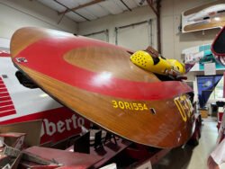 front view of a hydroplane race boat commonly called "thunderboat" sitting an an angle on it's trailer.