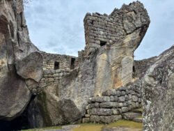 An example of a natural stone formation used as the foundation of small house structure.