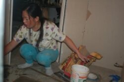 Winnie Putting Down A Bathroom Floor