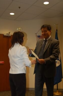 Winnie Receiving Her Citizenship Certificate