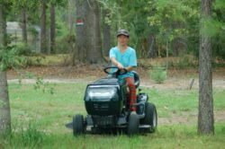 Winnie Driving the Lawnmower