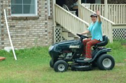 Second Photo - Winnie Driving the Lawn Mower
