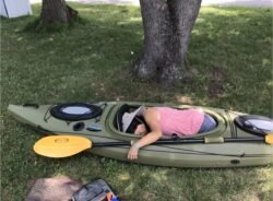 Winnie Sleeping in a Kayak
