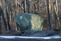 A large boulder shaped and painted to resemble a frog, named "Frog Rock," and located on Rte 44 in Connecticut, United States.