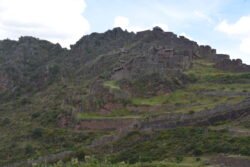 A grand view of what once was small houses and stone retaining walls integrated into the natural mountainsides. Part of the Sacred Valley archeological site of Pisaq.