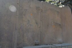 This is a detail of a stone wall in Ollantaytambo, created of huge cut and dressed stones separated by what appears to be "spacers" or flush column stones.