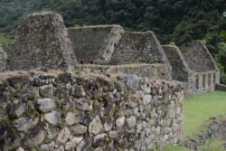 The remains of what was once a small farming village at the Inca Trailhead (Marker 104KM). This site shows several common features of Inca stonework in encased coursed masonry style, including roof lintels for supporting the roof poles, doorways and window openings, and wall niches.
