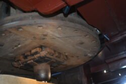 looking up at a great spur wheel, used in dutch windmills.