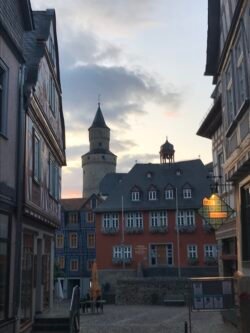 a view of old town idstein near sunset looking at the town hall with witches' tower behind it.